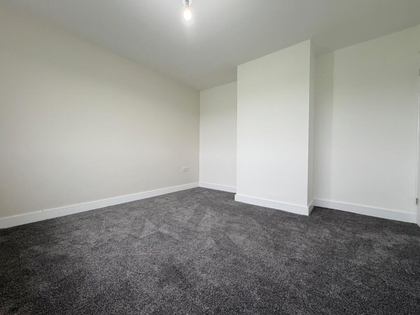 Refurbished living room with new carpet and full re-skim